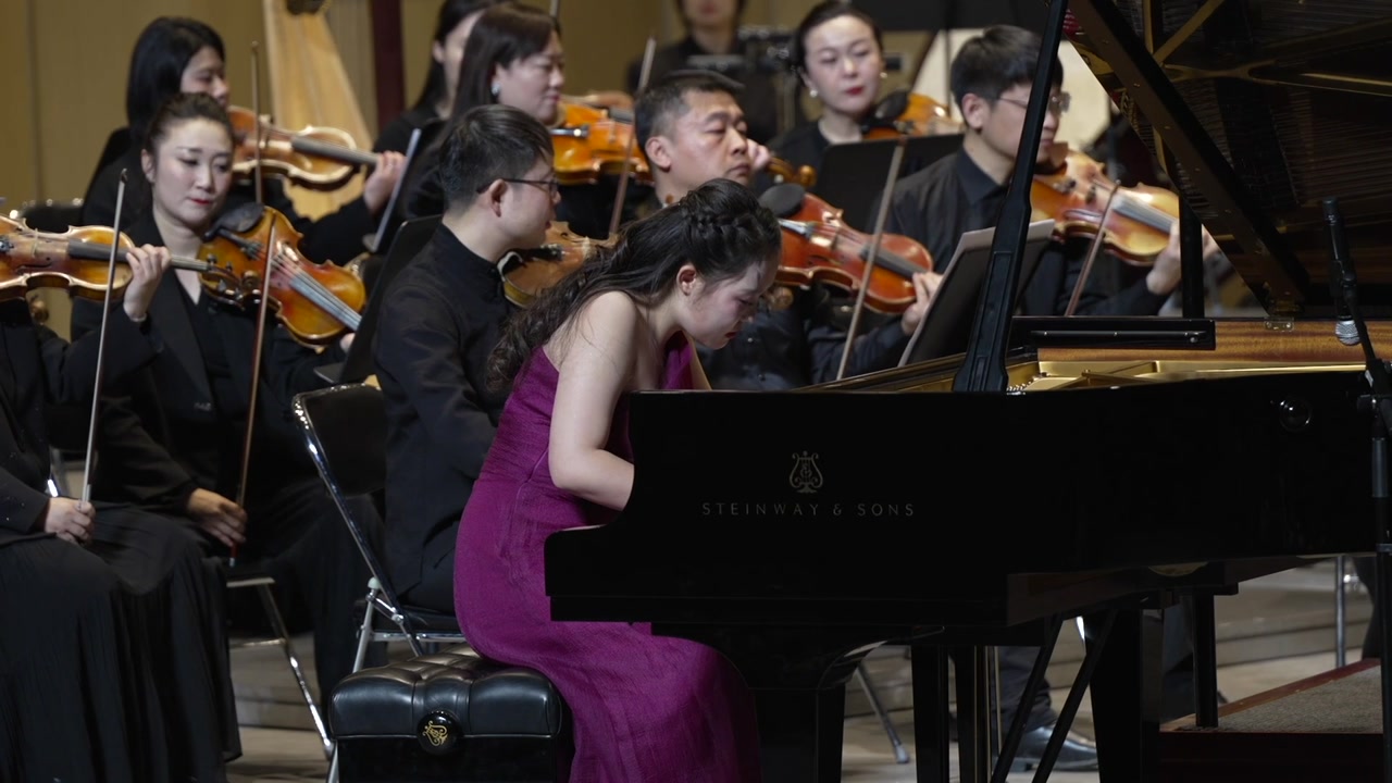 Herong Bai performing Grieg with the orchestra
